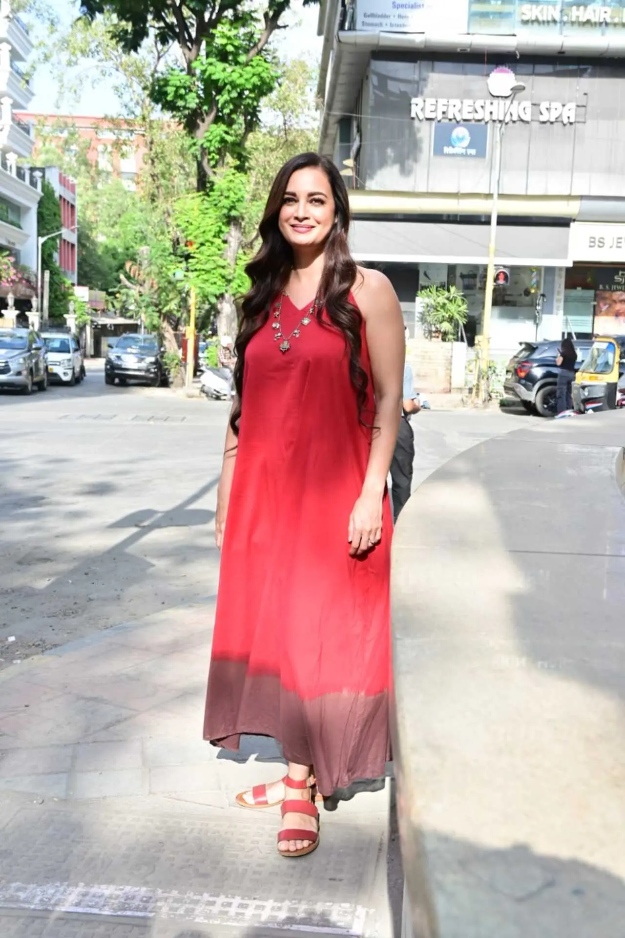 The actress paired the breezy outfit with comfortable red sandals, adding to the relaxed vibe. The actress paired the breezy outfit with comfortable red sandals, adding to the relaxed vibe.